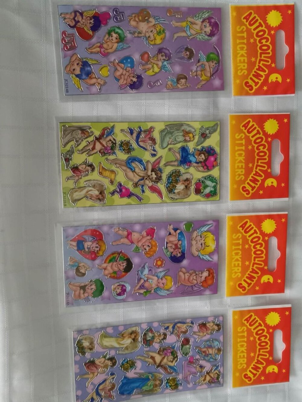 Set of 4 pages of vintage stickers, new in original plastic packaging